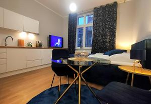 Kuchyňa alebo kuchynka v ubytovaní Hugo Star Apartments + 37 fotografií