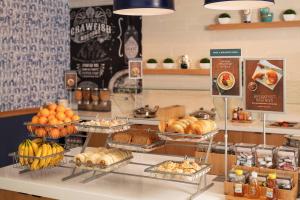 a bakery with many different types of bread and pastries at TownePlace Suites by Marriott New Orleans Downtown/Canal Street in New Orleans