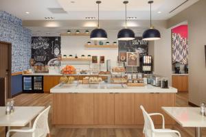 a fast food restaurant with tables and chairs at TownePlace Suites by Marriott New Orleans Downtown/Canal Street in New Orleans