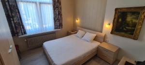 Cama o camas de una habitación en Alliance Hotel Ieper Centrum