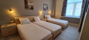 Cama o camas de una habitación en Alliance Hotel Ieper Centrum