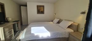 Cama o camas de una habitación en Alliance Hotel Ieper Centrum