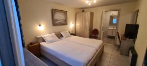 Cama o camas de una habitación en Alliance Hotel Ieper Centrum