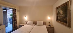 Cama o camas de una habitación en Alliance Hotel Ieper Centrum