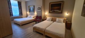 Cama o camas de una habitación en Alliance Hotel Ieper Centrum