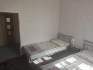 Posteľ alebo postele v izbe v ubytovaní Penzion U Soudu
