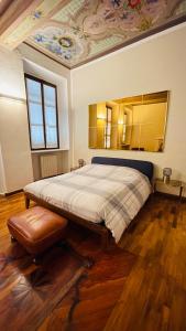 سرير أو أسرّة في غرفة في Appartamento La Corte