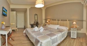 Ένα ή περισσότερα κρεβάτια σε δωμάτιο στο Hotel Andreis