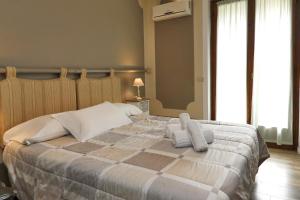 Ένα ή περισσότερα κρεβάτια σε δωμάτιο στο Hotel Andreis