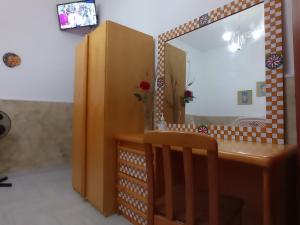 A television and/or entertainment centre at Mary Home - Casa Vacanza Taormina