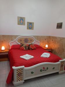 Mary Home - Casa Vacanza Taormina tesisinde bir odada yatak veya yataklar