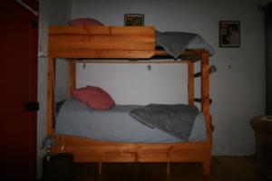 two bunk beds in a small room with at Studio Les Pourettes in Feusines