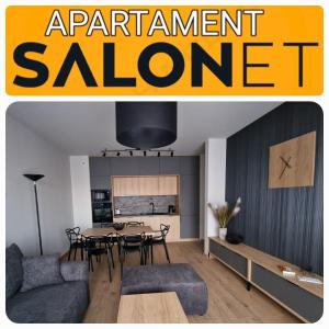 a living room with a table and a dining room at Apartament SALONET Airport & MTP in Skórzewo