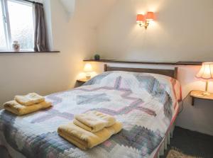 מיטה או מיטות בחדר ב-The Cottage