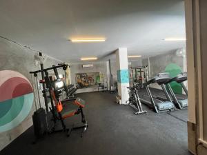 a gym with several treadmills and machines in a room at Blanco Hideout Railay - Youth Hostel 18 to 35 Only in Railay Beach