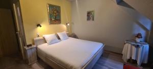 Voodi või voodid majutusasutuse Hotel Landhuis 't Wilgenerf toas