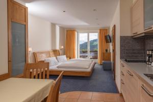 Postel nebo postele na pokoji v ubytování Aparthotel Tritscher