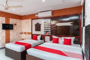 Postel nebo postele na pokoji v ubytování Gnanam Beach Residency