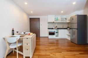 Cucina o angolo cottura di The Title Rawai West Wing Pool View Suite
