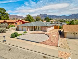 an aerial view of a house with a basketball court at Home with Mountain View/Pool/Tub in El Paso