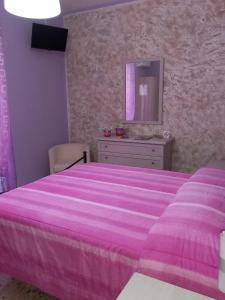 A bed or beds in a room at nAnA'