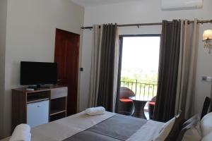 Кровать или кровати в номере L'Oiseau de L'Ocean Tourist Residence