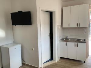 Kuchyň nebo kuchyňský kout v ubytování Apartmani Vidakovic
