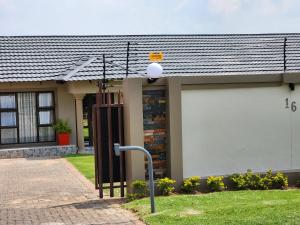 a house with a street light in front of it at Savanna Buffalo Guest House in eMalahleni