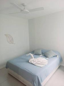 Ένα ή περισσότερα κρεβάτια σε δωμάτιο στο Beachfront Apartment