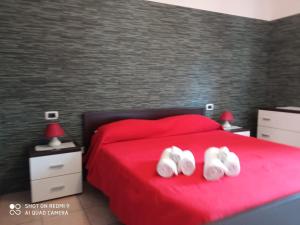 Ένα ή περισσότερα κρεβάτια σε δωμάτιο στο B&B Tanca Marracconi Teulada