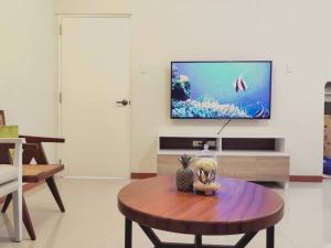 TV at/o entertainment center sa Cozy 3BR Home with Garden, Pool & Modern Comforts