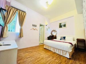 Katil atau katil-katil dalam bilik di Sweet B&B 幸福微甜民宿