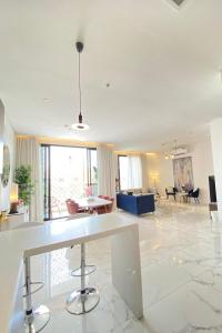 a large living room with a table and chairs at Spacious new 2 bedroom Apt-in amazing location B6 in Riyadh