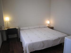 Posteľ alebo postele v izbe v ubytovaní Hostal El Estudio