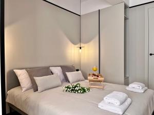 a bedroom with a large bed with white pillows at Apartamenty Małgorzaty Sobczak in Jelenia Góra