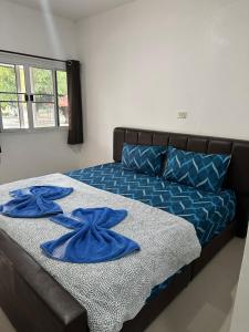 Postel nebo postele na pokoji v ubytování Kalae Resort