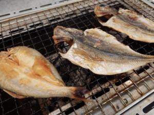 three dead fish sitting on a rack on a grill at Breezbay Shuzenji Hotel in Izu