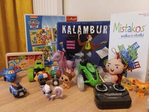 a group of toys and books on a table at Apartament Centrum Białystok in Białystok
