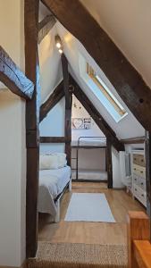 a attic room with a bed and a bedroom at Appartement Saint Malo vue sur mer et sur intra muros, Ferry, plage et commerces à 50 m in Saint Malo