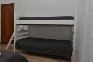 A bed or beds in a room at Amaryllis Apartments