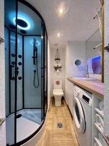 a bathroom with a shower and a toilet and a sink at Oikiastudios in Patra