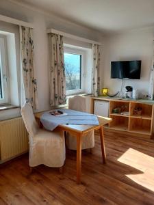 Telewizja i/lub zestaw kina domowego w obiekcie Appartementhaus Fritz-Rosenkranz