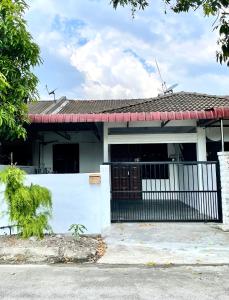 a house with a gate and a fence at Home33#2pax#wifi&netflix#NearAeonAlma#5kmIconCity#5kmtoSimpangAmpat in Bukit Mertajam