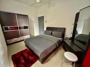 a bedroom with a bed and a mirror and a stool at Home33#2pax#wifi&netflix#NearAeonAlma#5kmIconCity#5kmtoSimpangAmpat in Bukit Mertajam