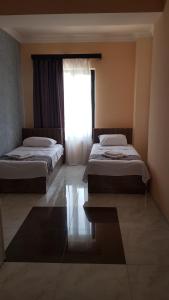 Voodi või voodid majutusasutuse RP HOTEL (NEW) toas