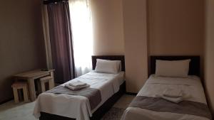 Voodi või voodid majutusasutuse RP HOTEL (NEW) toas