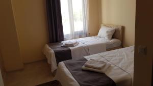 Voodi või voodid majutusasutuse RP HOTEL (NEW) toas