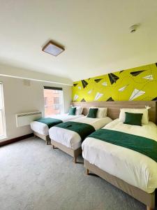 Uma cama ou camas num quarto em The Norseman Temple Bar