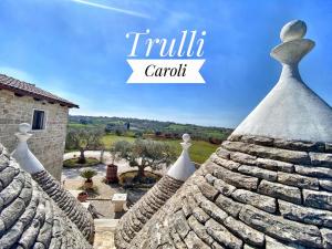 a view from the roof of a house with the words trillin carril at Trulli Caroli in Locorotondo