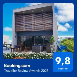 a review of the travel review awards sign in front of a house at Villas de Bananeiras in Bananeiras